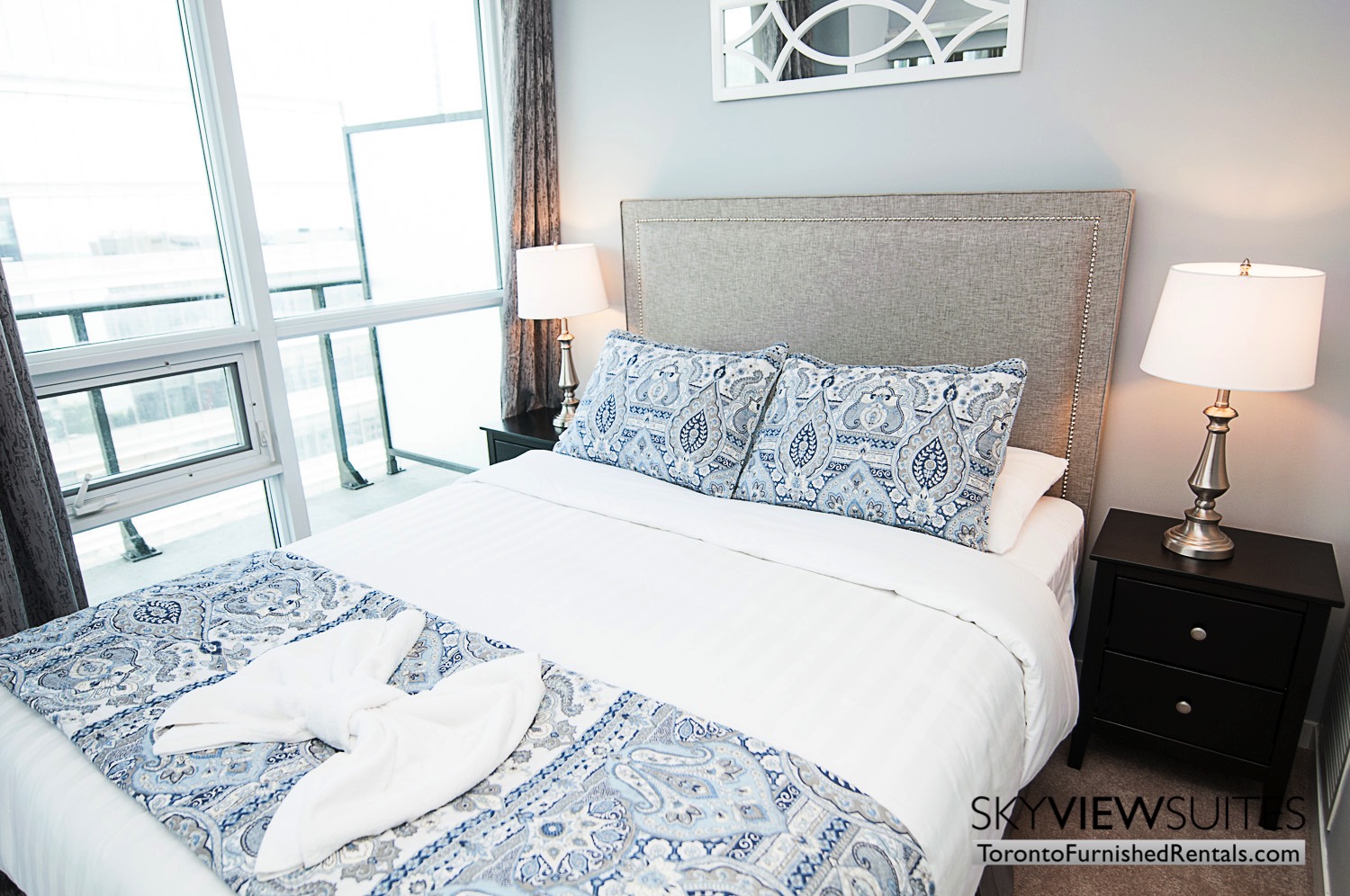 MLS furnished condo toronto bedroom blue pillows