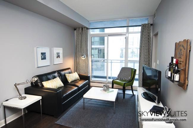 LTD corporate rentals toronto couch and green chair