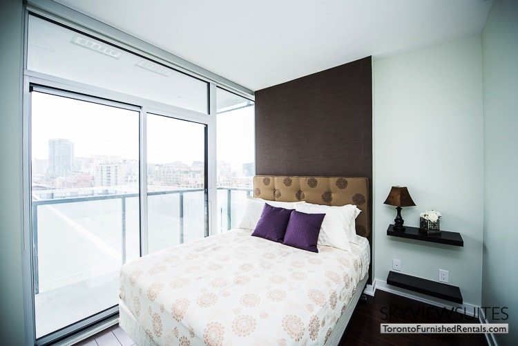 Market Street Toronto corporate rentals toronto bedroom purple pillows
