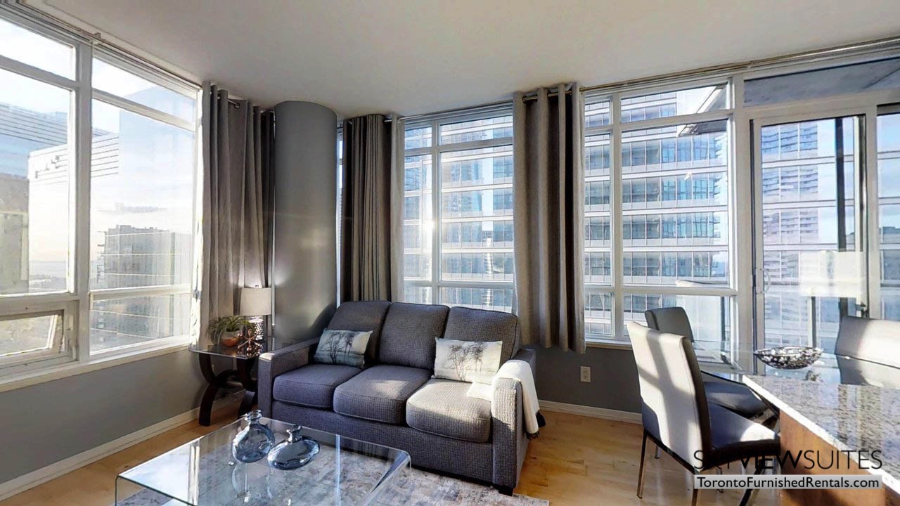 furnished rentals toronto york and bremner living room with windows and lighting
