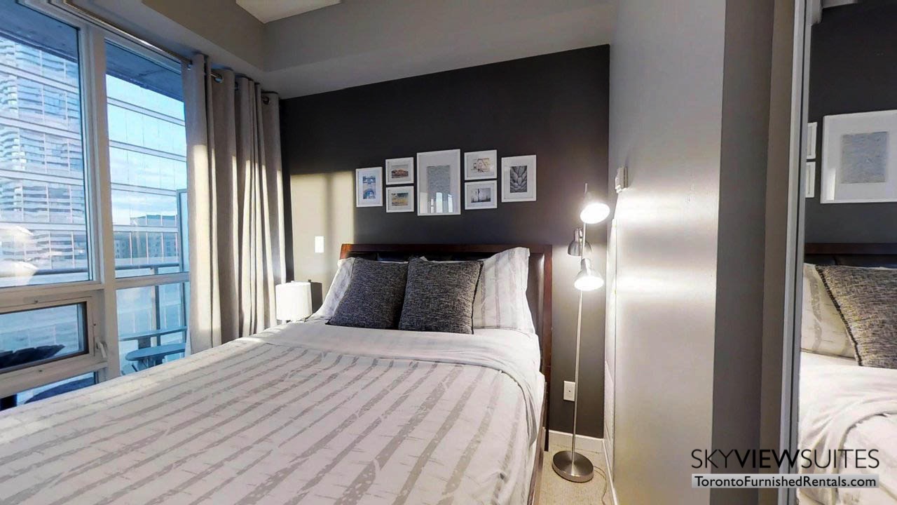 furnished rentals toronto york and bremner bedroom with balcony in room