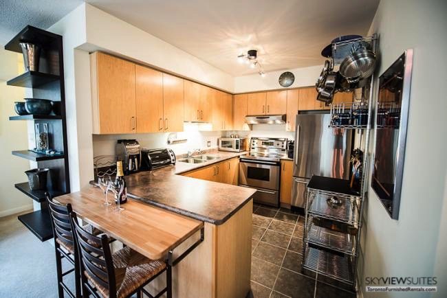 Liberty Village serviced apartments toronto kitchen with toaster oven and refrigerator