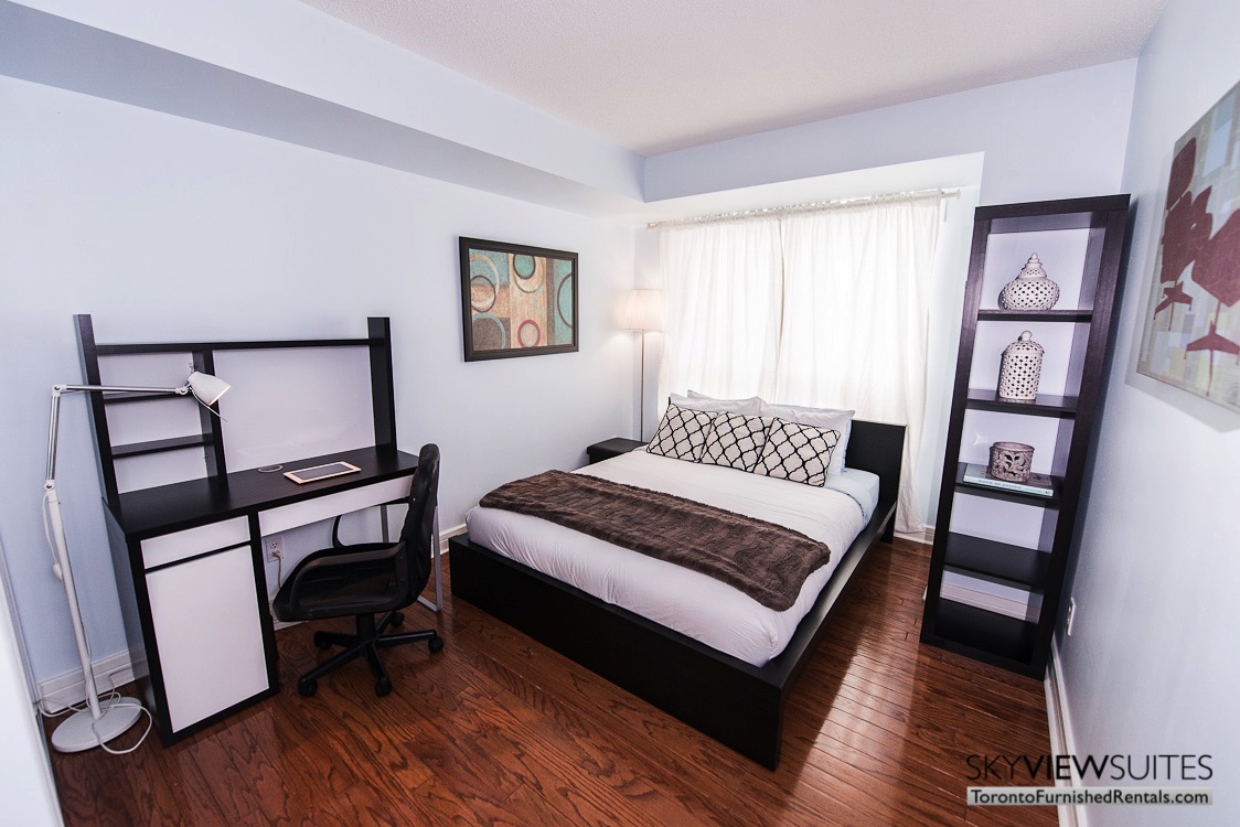 corporate rentals toronto Avondale bedroom with workspace