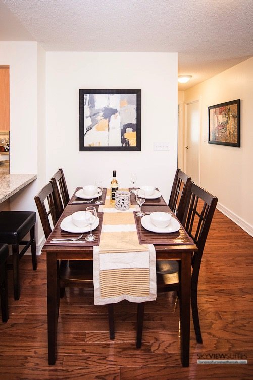 corporate rentals toronto Avondale dining table with bottle of wine