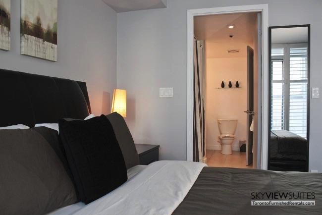 furnished apartments toronto boutique bedroom with en suite bathroom
