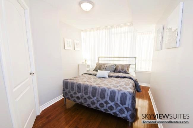 North York executive rentals Toronto bedroom with blue sheets