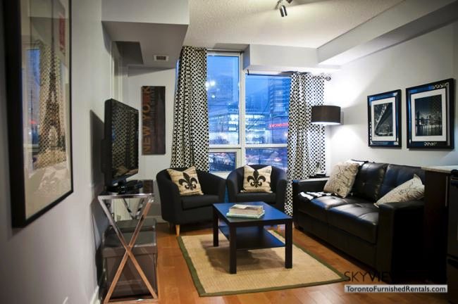 furnished suites toronto harbourfront living room with fleur-de -is pillows