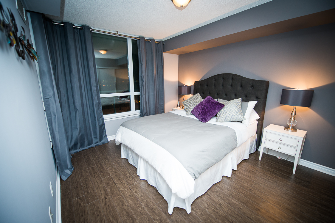 short term rentals toronto the empire bedroom with purple pillow