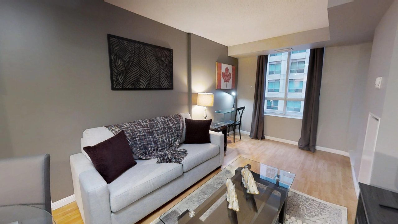 furnished suites toronto university plaza living room featuring couch