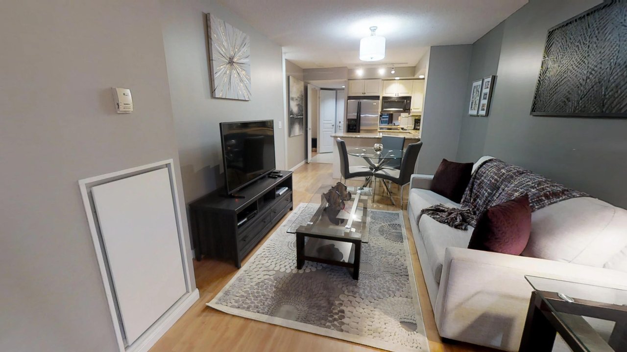 furnished suites toronto university plaza television and couch open concept condo