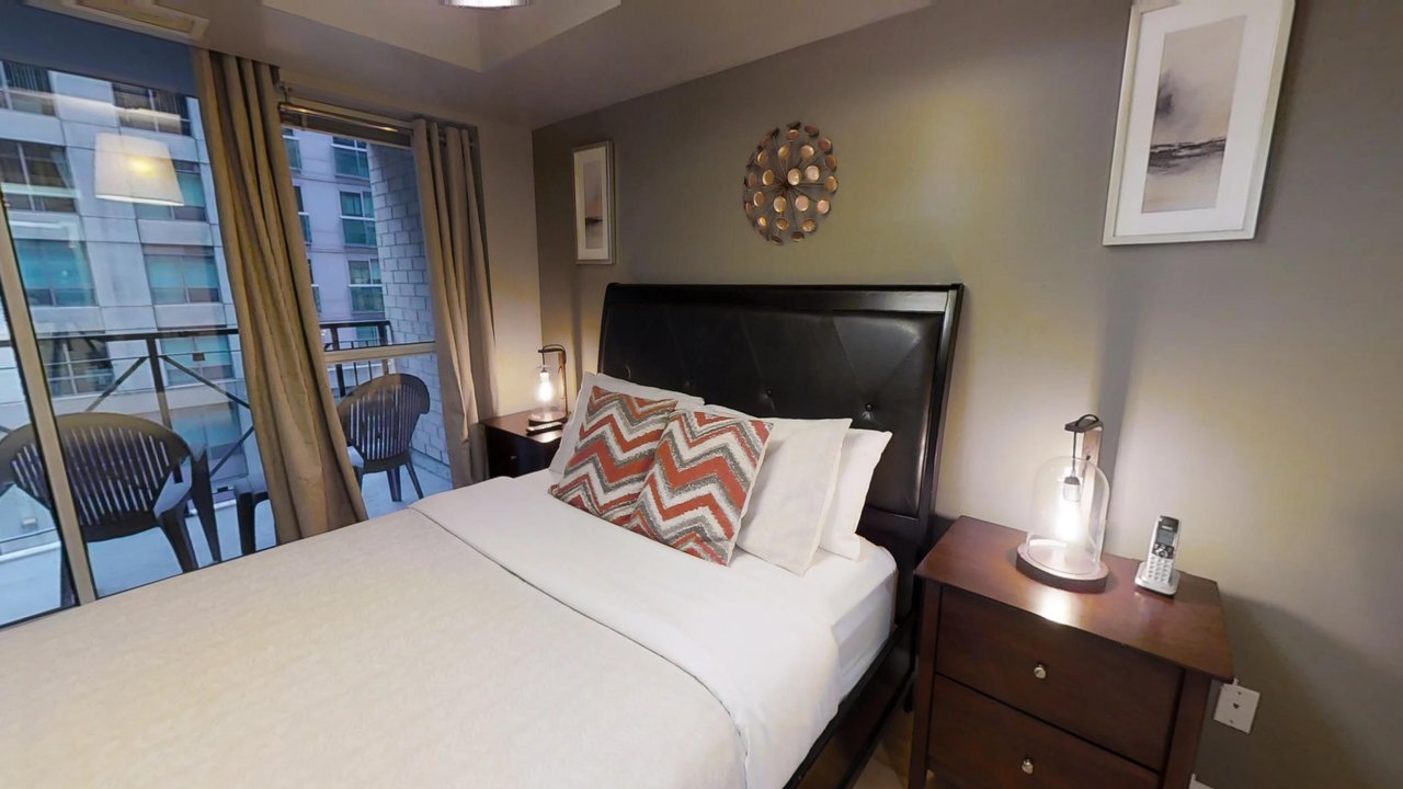 furnished suites toronto university plaza bedroom with patio