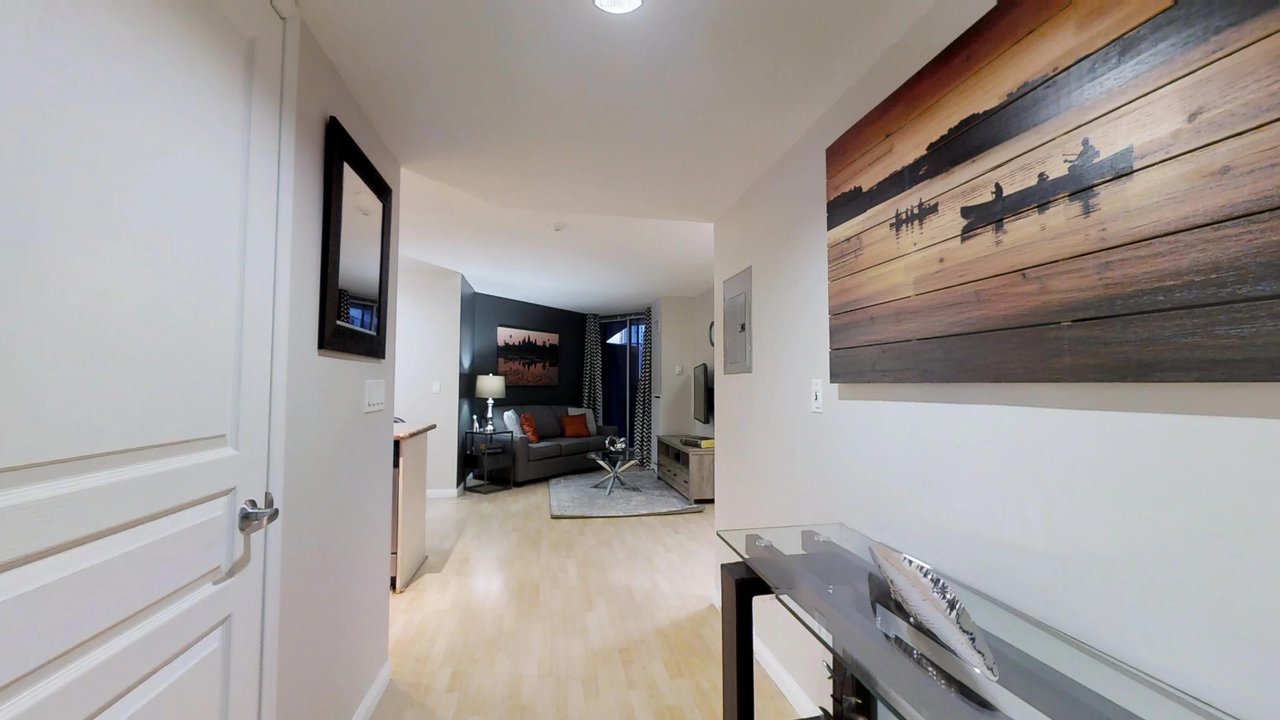 furnished apartments toronto university plaza foyer with art and view of living room