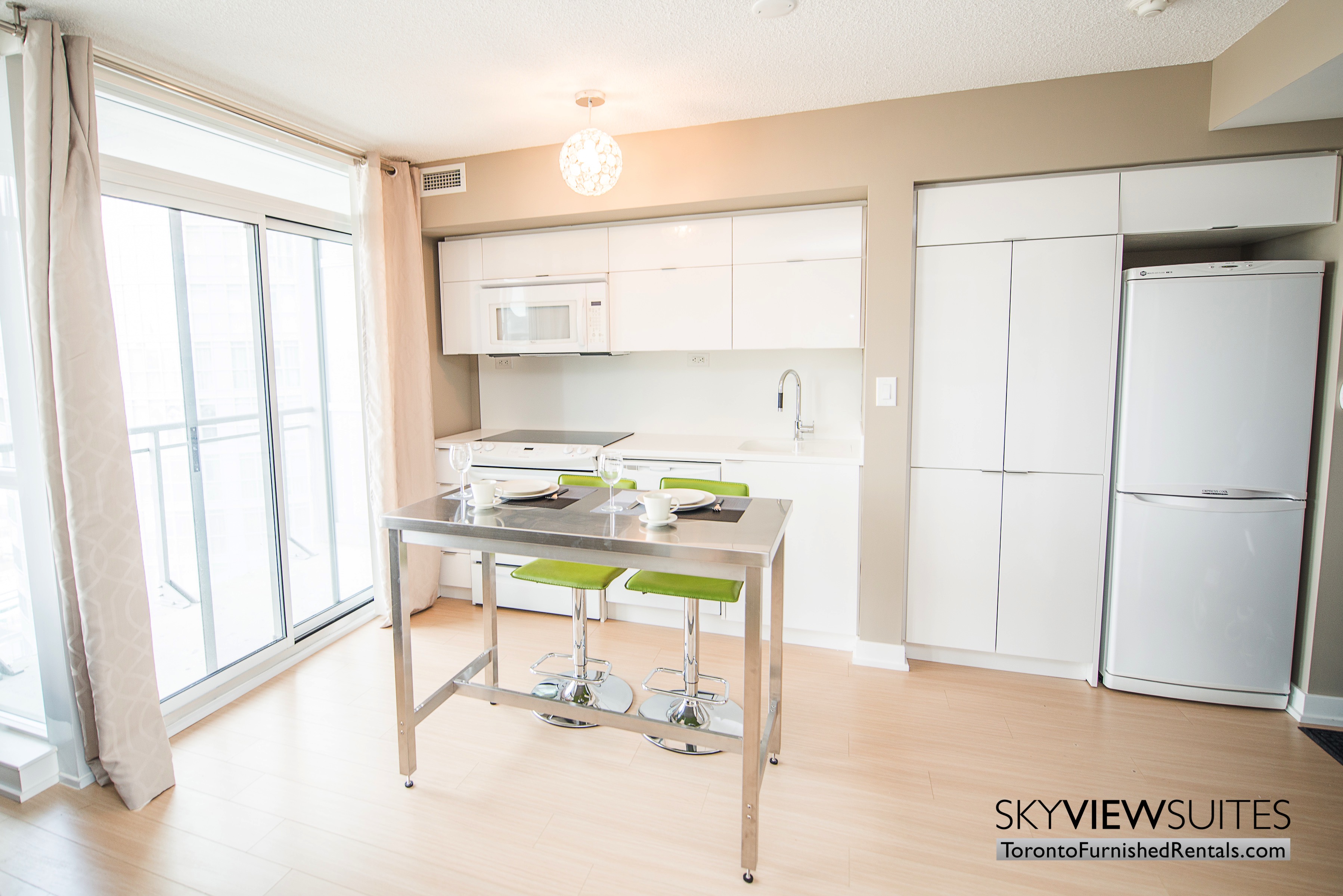 furnished apartments toronto parade kitchen and dining table