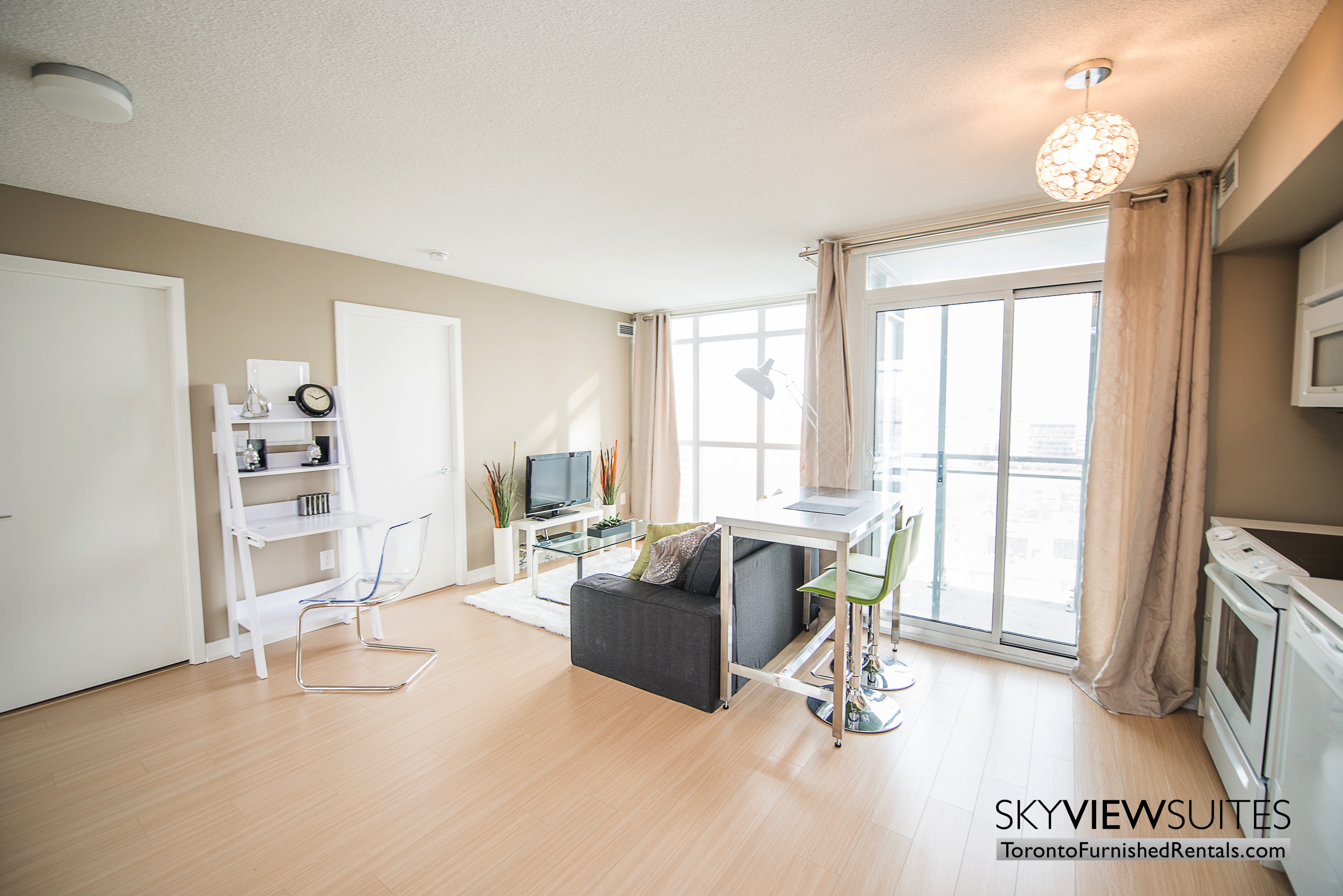 furnished apartments toronto parade living room kitchen and dining table