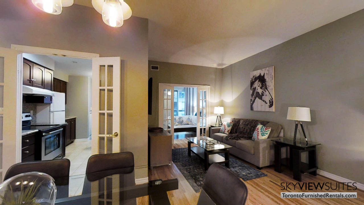 short term rentals toronto qwest view of living room, kitchen and bedroom