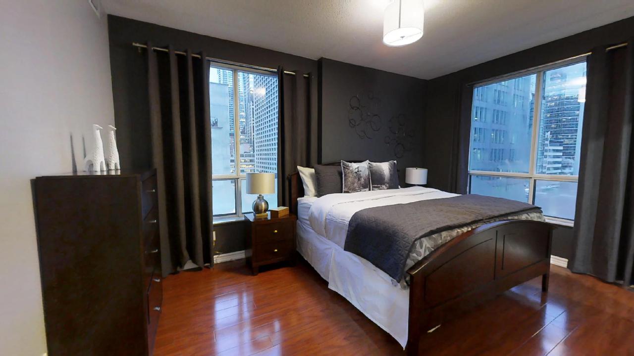 bedroom in a furnished apartment located near queen and simcoe, in toronto