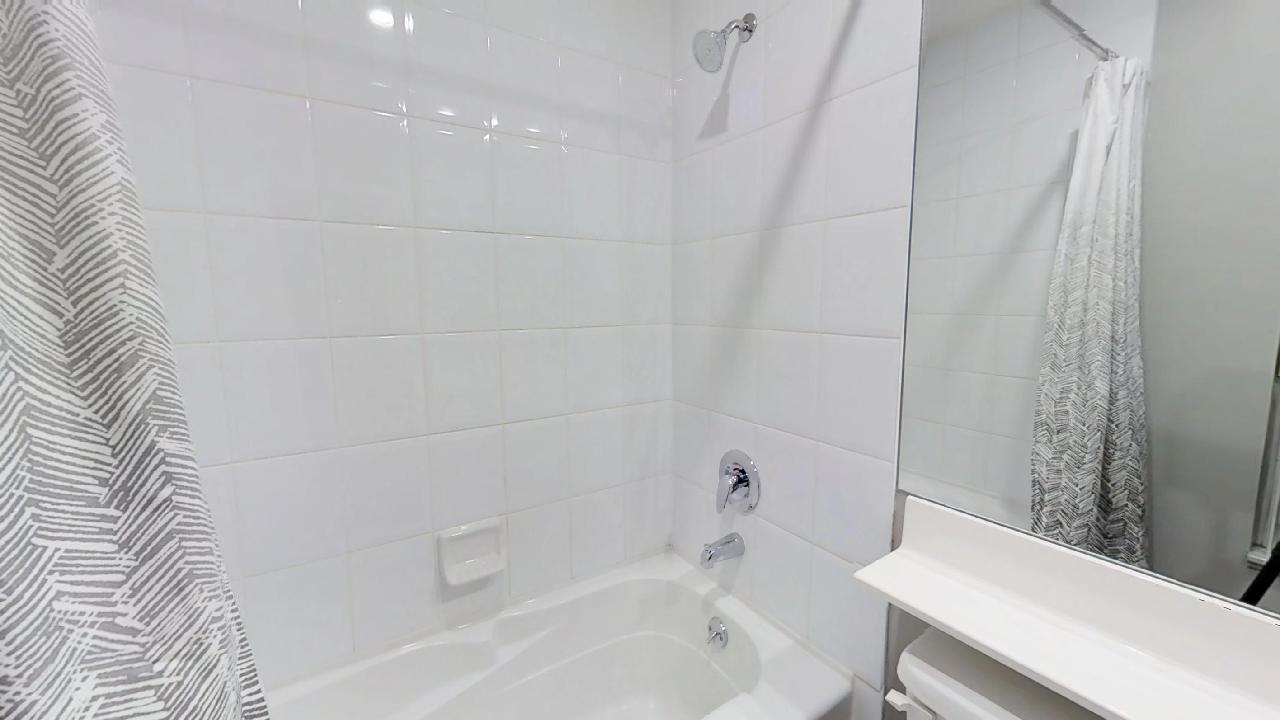 bathroom in a furnished condo near st andrews subway stop in toronto