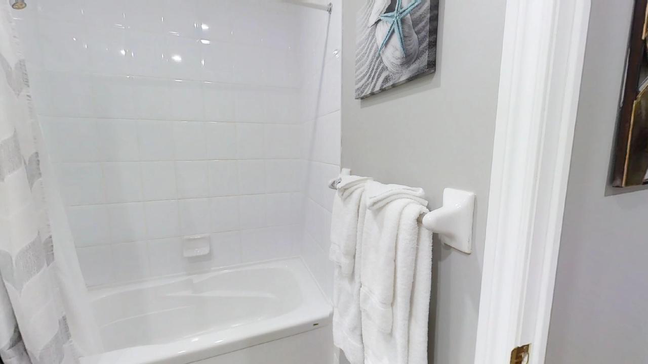 bath towel and shower in a toronto furnished apartment's bathroom, near simcoe and richmond streets