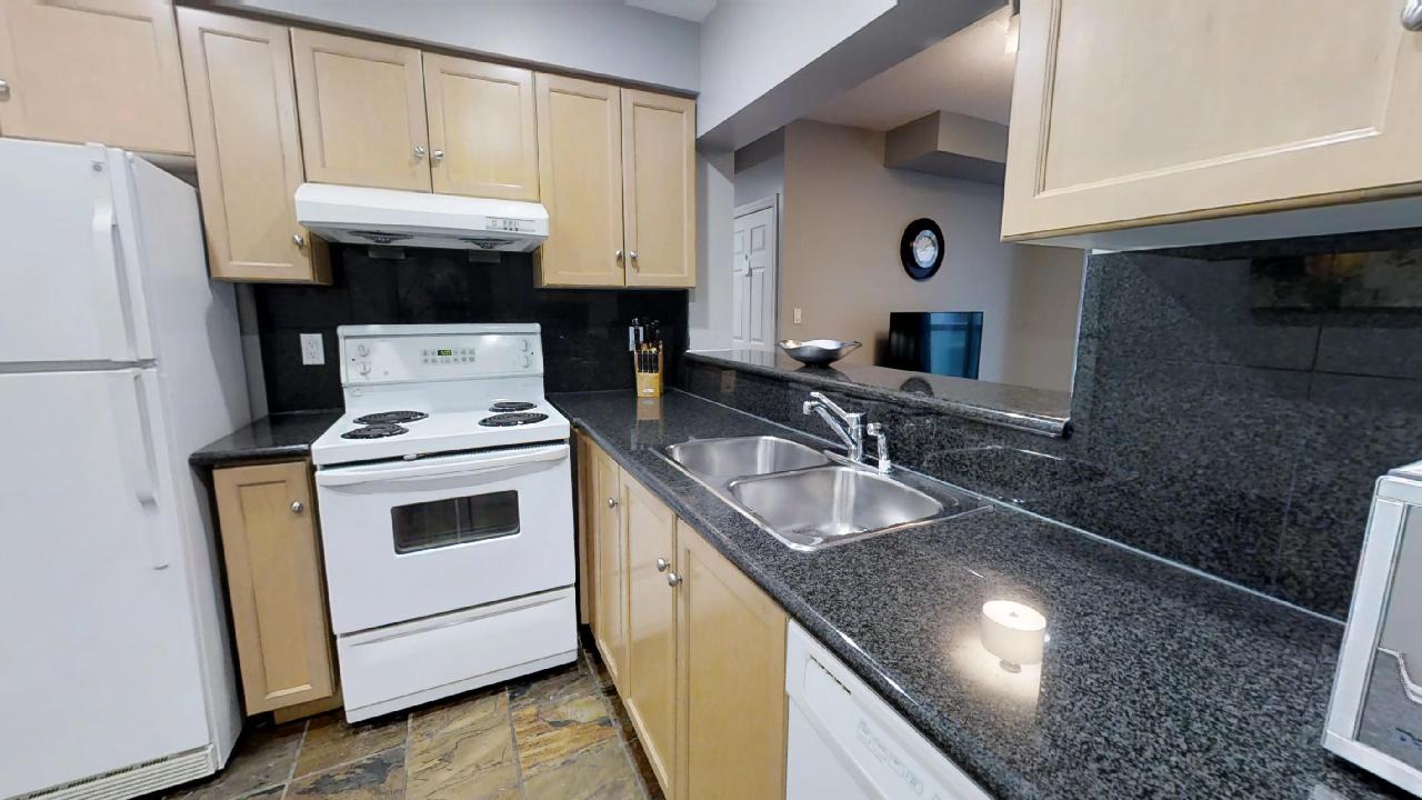 the kitchen of a toronto furnished apartment off of Queen and Simcoe