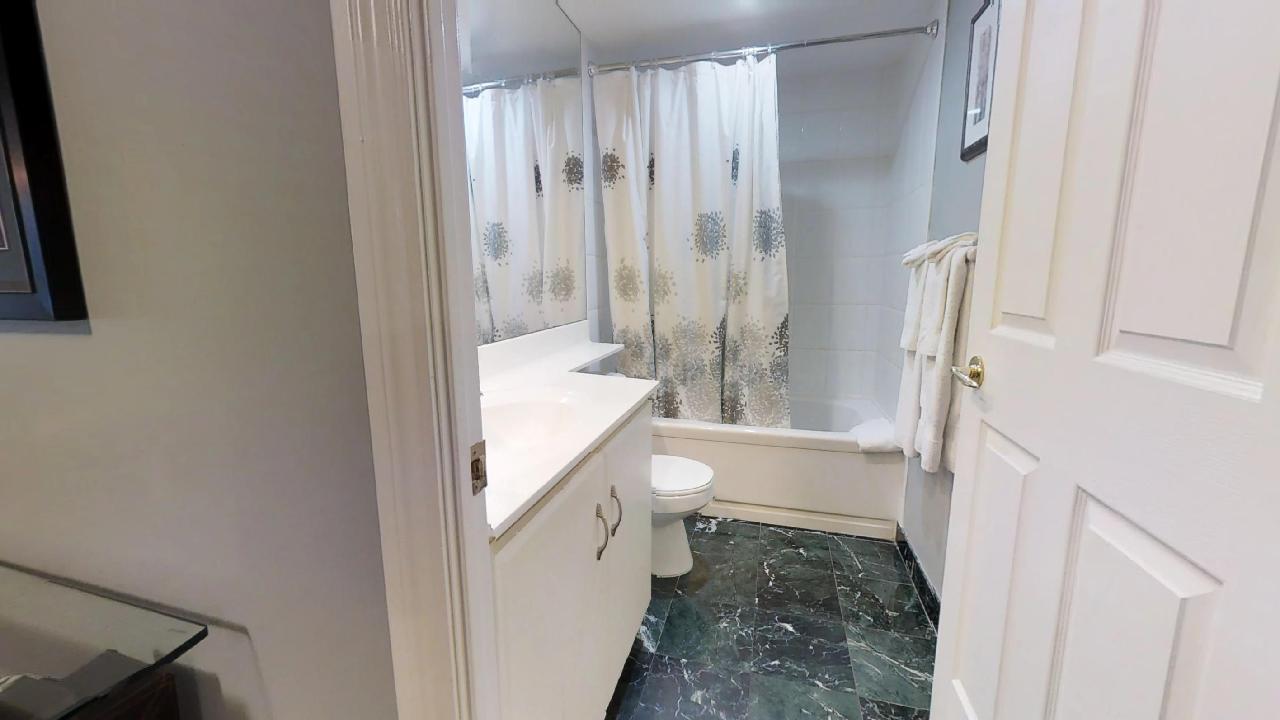 bathroom in a furnished apartment near osgoode station