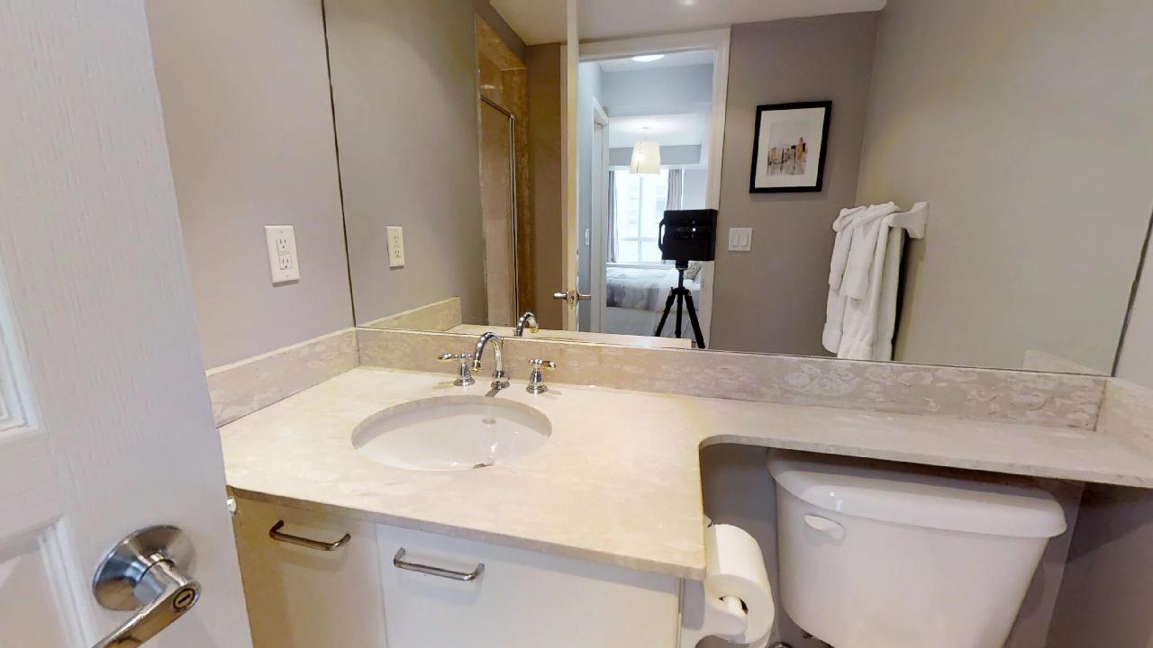 a bathroom in a fully furnished apartment for rent in downtown Toronto at University Plaza