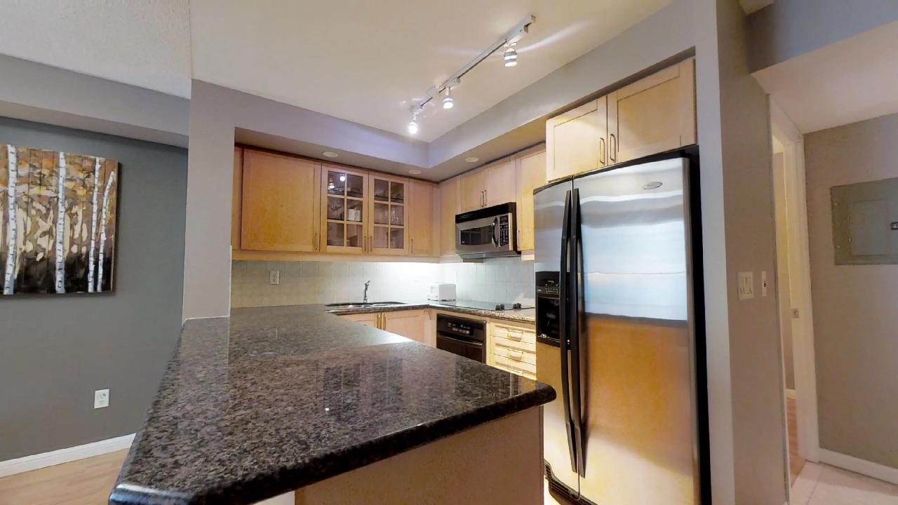 Fully furnished kitchen in a Toronto furnished condo, located near University Plaza