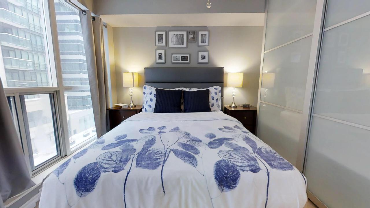 blue bed, featured in a toronto furnished apartment