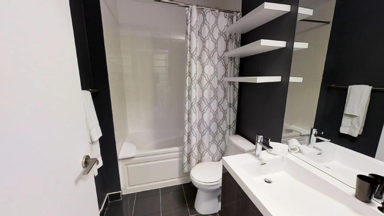 a fully furnished bathroom, by Sky View Suites