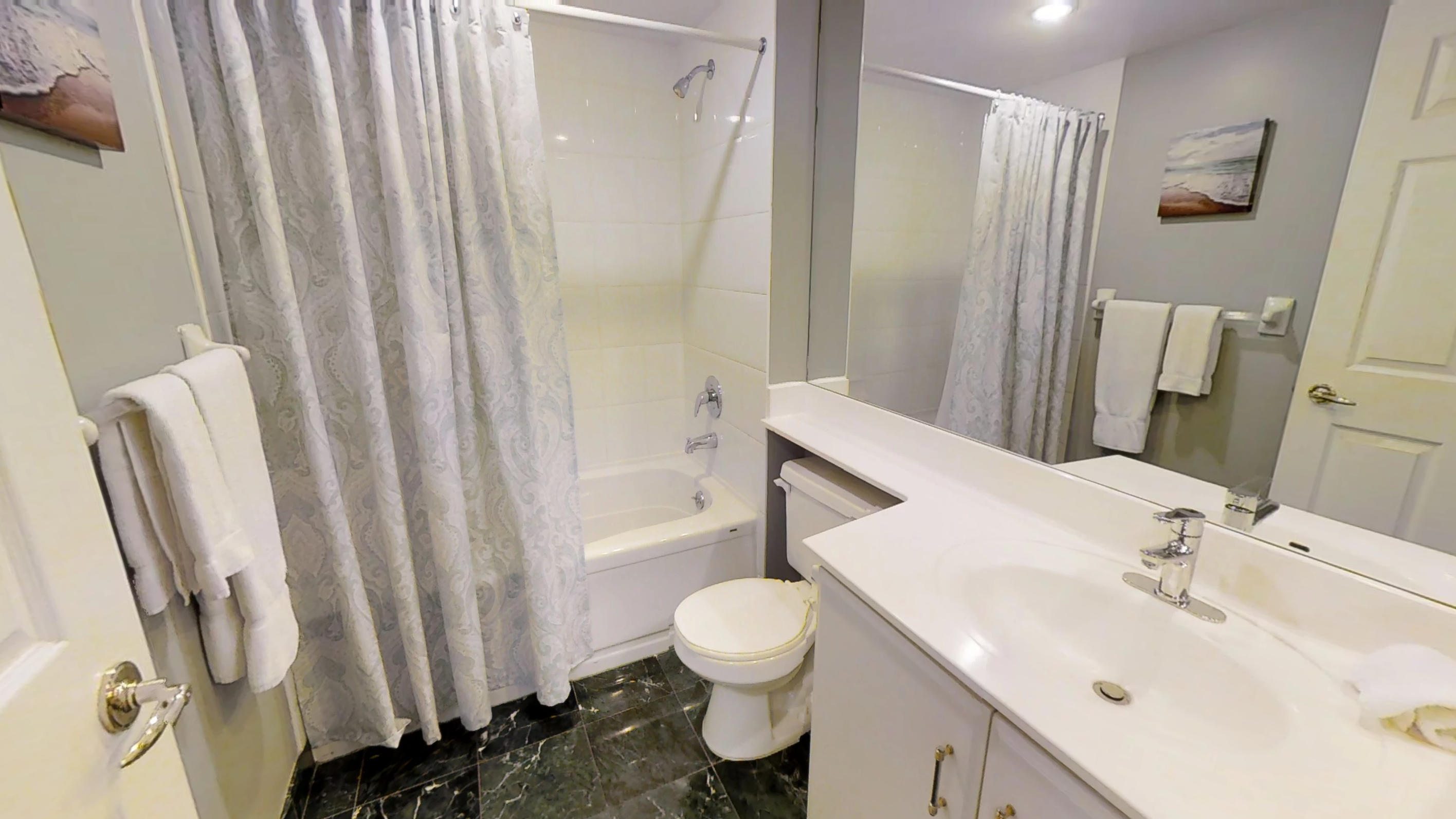Furnished bathroom in a one bedroom furnished apartment in Qwest